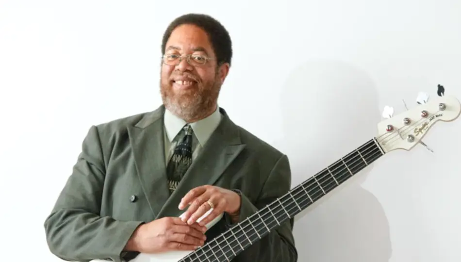Doc Woods holding his guitar